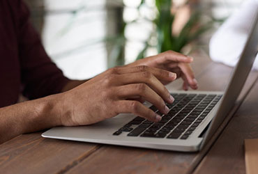 Courses person using macbook